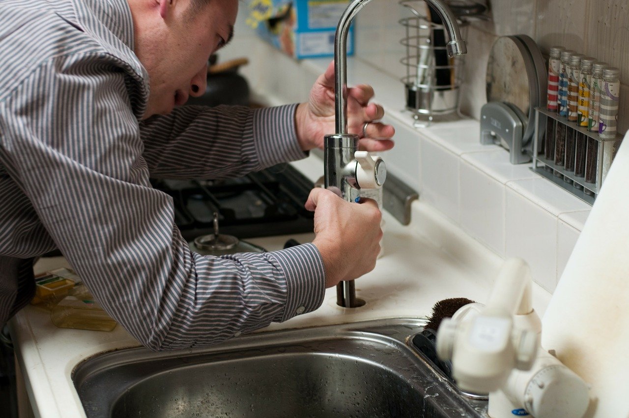 Man fixing a tap