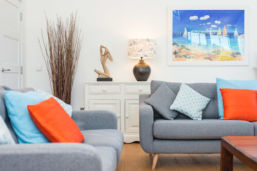 living room with two grey modern sofas