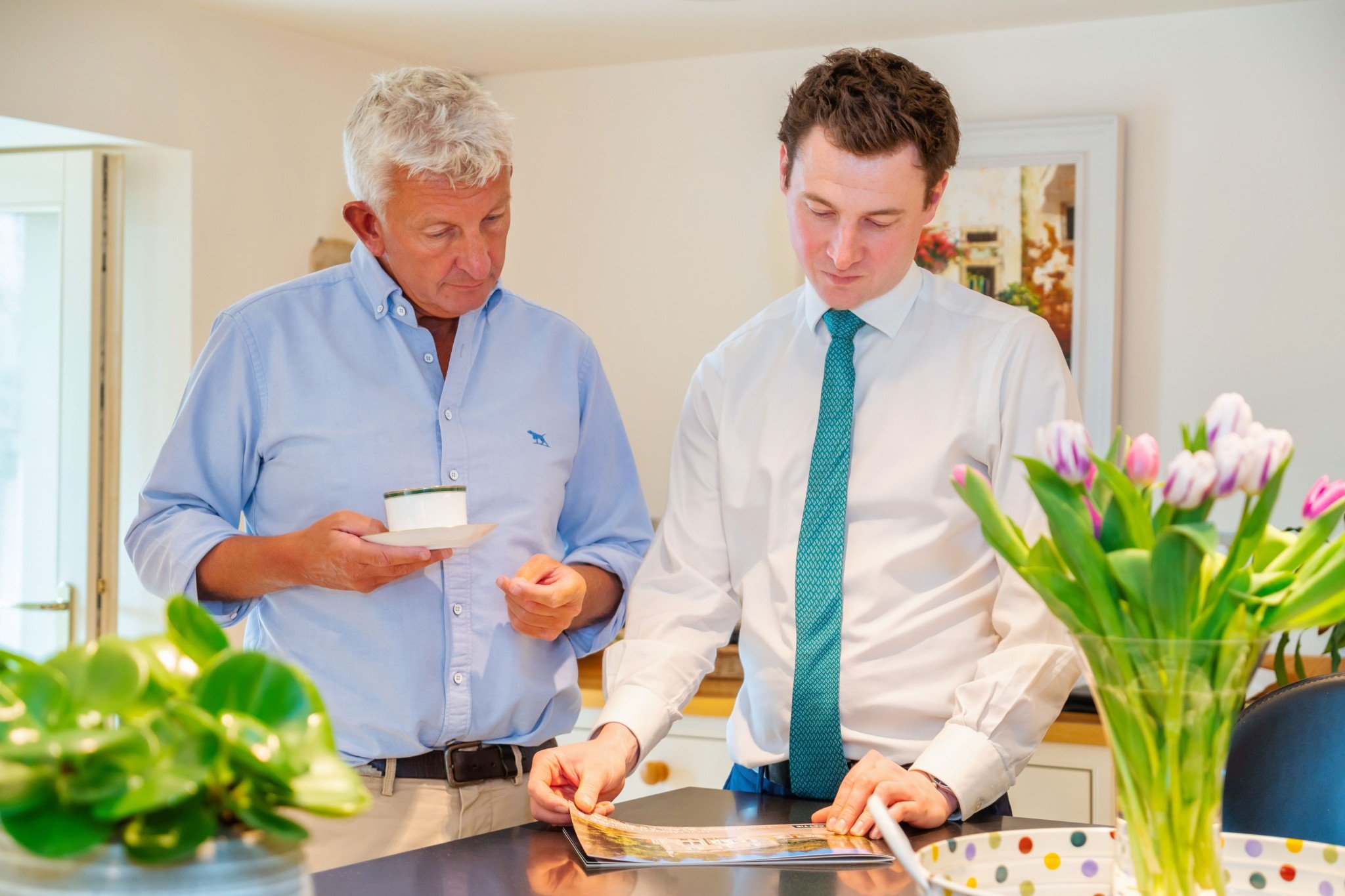 Two men looking at brochure