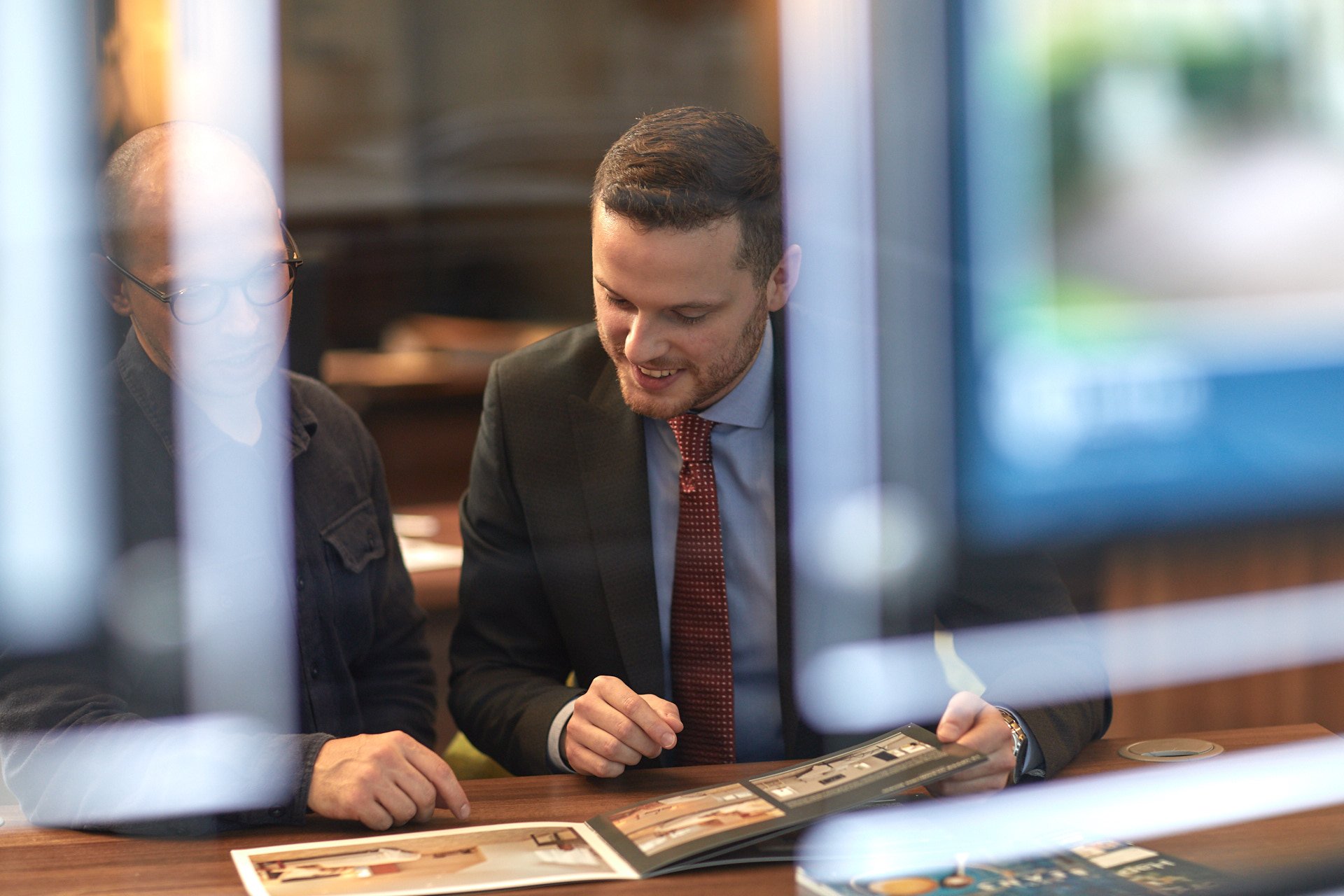 Looking through window at man at desk