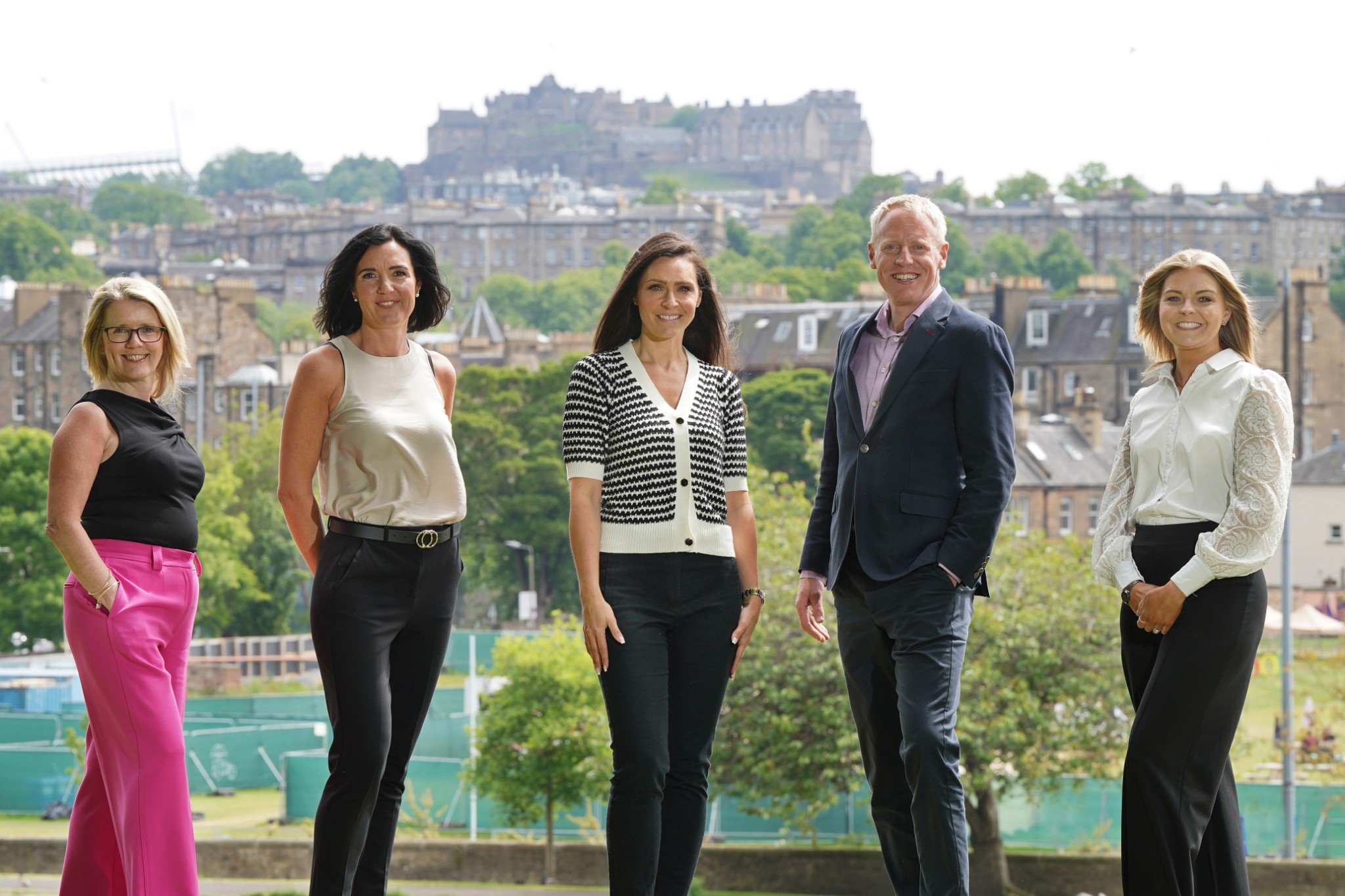 Edinburgh Lettings senior team in Inverleith Park with Edinburgh Castle in the background