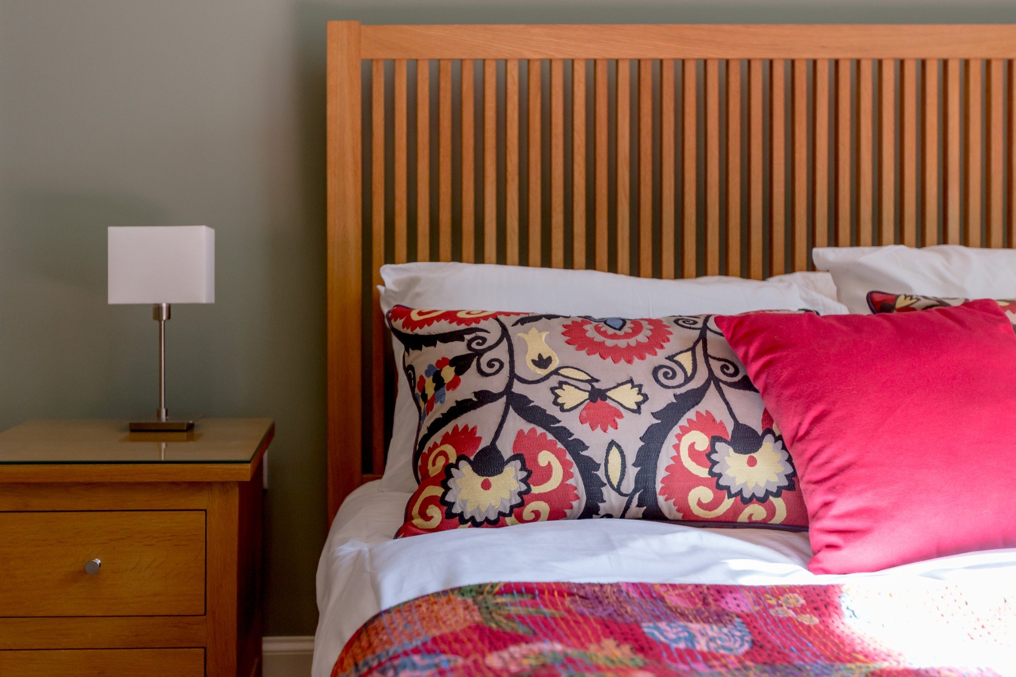 Bedroom photo with oak bed and pink bedding