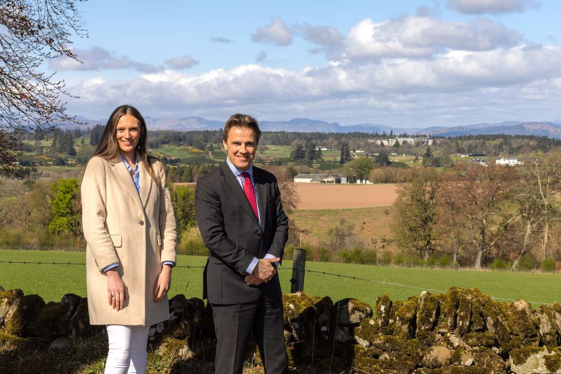 Joanna Tinson and Alastair Houlden standing with Gleneagles in the background