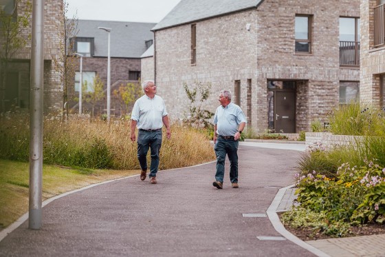Joe and Pat Headon walking through St Andrews West