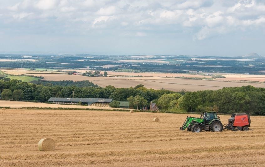 Spott Estate farmland with tractor in field