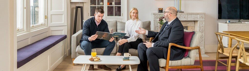 Couple chatting to their mortgage broker