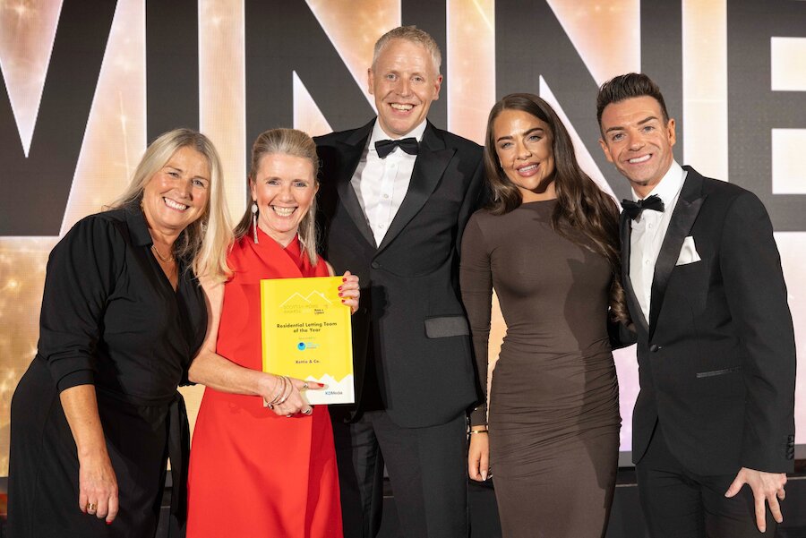 An image of the team collecting the Award