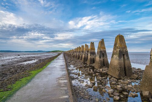 Photo of walkway alongside the sea shore